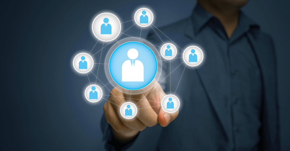 Elevating Mortgage Bfsi Operations: How Azure Cloud Solutions Drive Efficiency And Innovation 1 A business professional points to a floating digital interface showcasing a network of human icons, symbolizing leadership and management in a corporate structure
