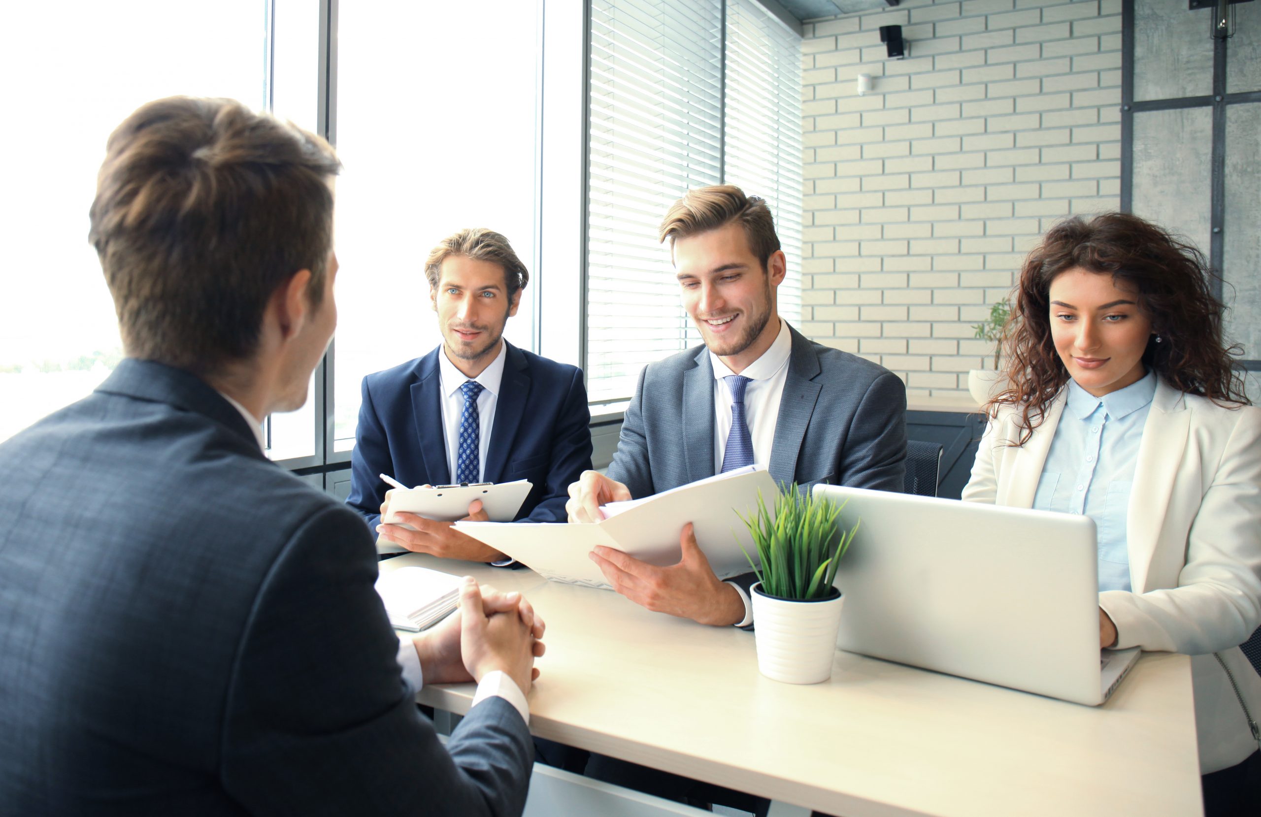 job interview with employer businessman listen candidate answers 1 scaled