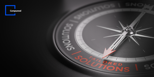  This image displays a close-up view of a compass, with the needle sharply in focus pointing towards the word "SOLUTIONS" highlighted in red. Around the compass, words in a lighter shade, possibly denoting different business strategies or services, create a circular border. One segment of the compass edge is emphasized in red, with the phrase "TAILORED SOLUTIONS" written across it, indicating a focus on customized services. The background is dark, with a soft light casting a glow on the compass, which adds depth and a professional feel to the image.