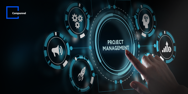 A hand interacts with a holographic interface focused on "PROJECT MANAGEMENT" surrounded by various business-related icons, with the Compunnel logo above. 
