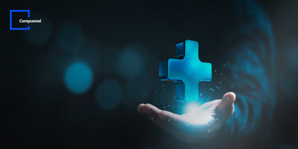 An open palm holds a floating, glowing blue cross, depicting healthcare technology, with a bokeh background and 'Compunnel' logo.
