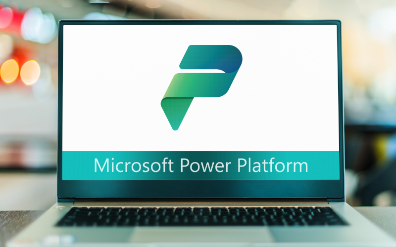 Laptop displaying Microsoft Power Platform logo on screen, representing digital transformation capabilities. 