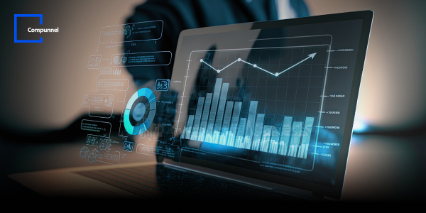 Digital transformation concept featuring a laptop displaying analytics and data visualizations. The screen shows various graphs and charts with rising trends, symbolizing business growth and data-driven decision-making. Compunnel logo is visible in the top left corner